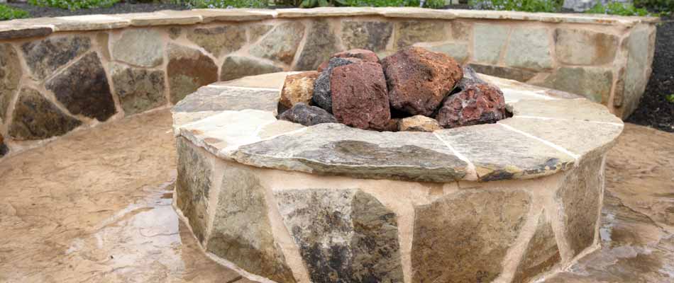 Custom designed and built fire-pit in the backyard of a homeowner in Palmetto