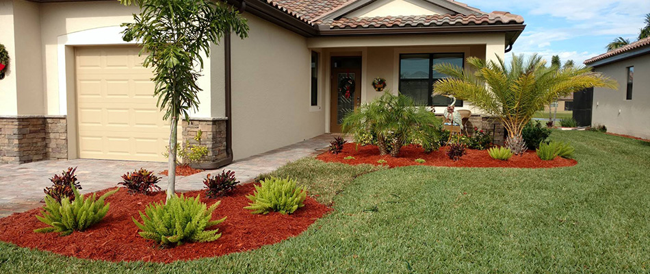Red mulch added o landscape bed in North Port, FL.
