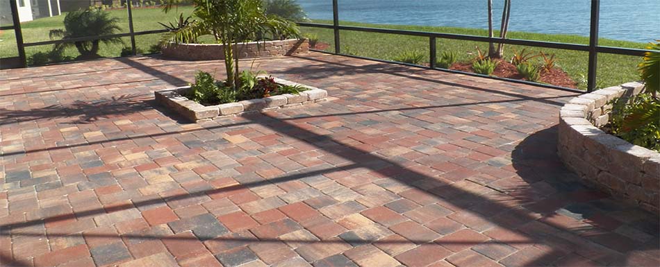 Residential hardscaping patio designed by Three Seasons using pavers and retaining walls.