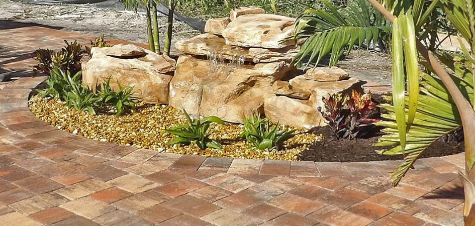 Custom rock/boulder waterfall on residential property in Palmetto, FL.
